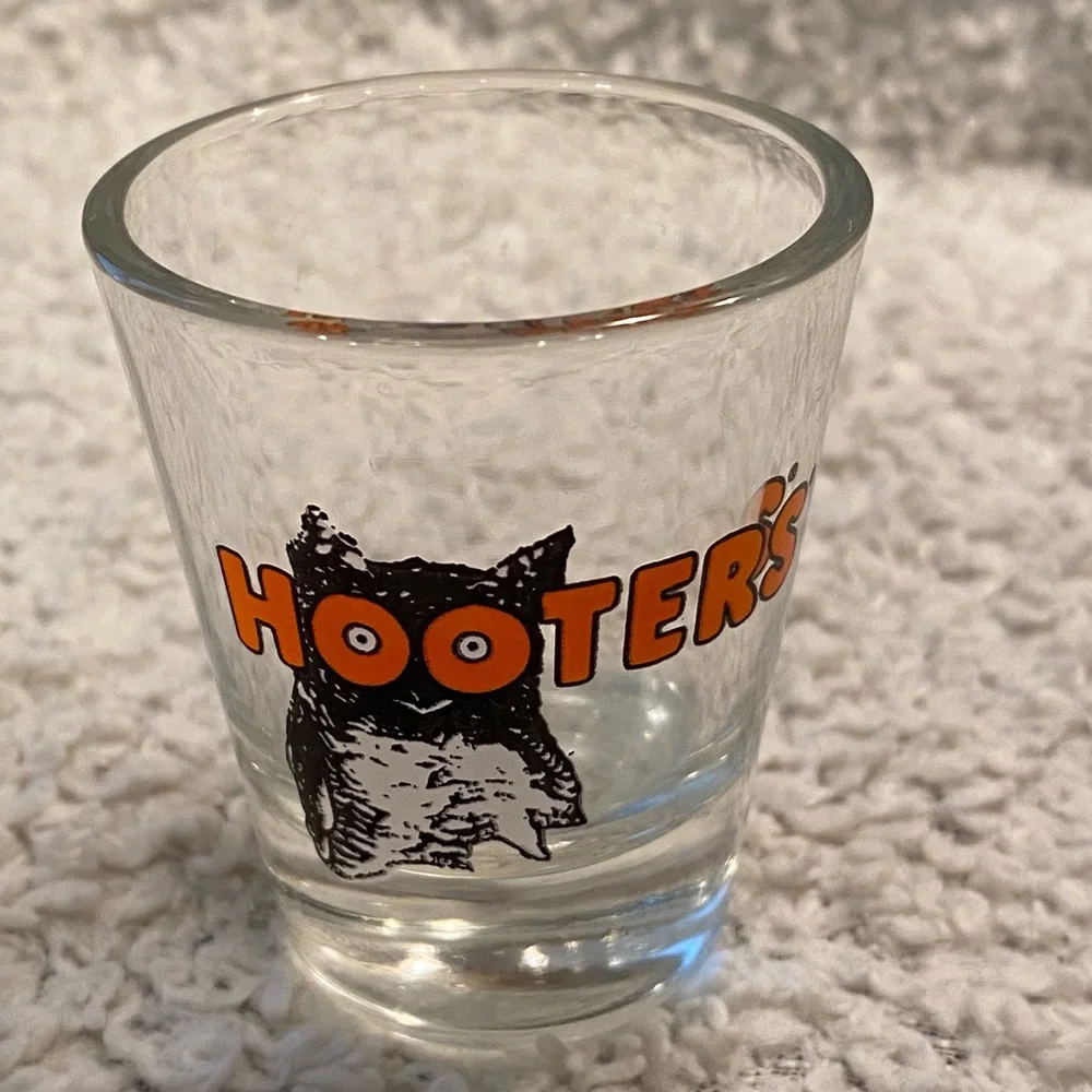 Hooter’s shot glass,  white orange with owl logo, no city specified